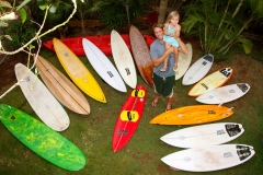 Father and daughter with surfboards